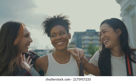 Portrait Of Beautiful Ladies Looking To Camera And Smile At City Town. Slow Motion Shot.