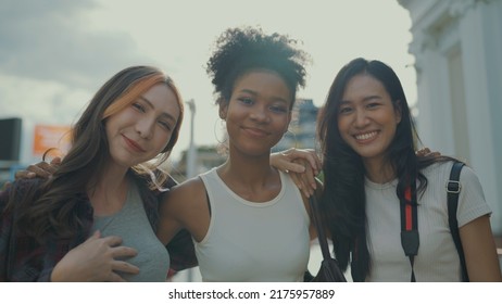 Portrait Of Beautiful Ladies Looking To Camera And Smile At City Town. Slow Motion Shot.