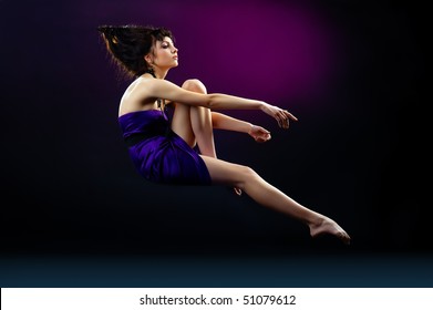 The Portrait Of A Beautiful Lady Wearing A Violet Dress And Zero Gravity