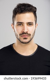 Portrait Of A Beautiful Latin Man With A Serious Expression