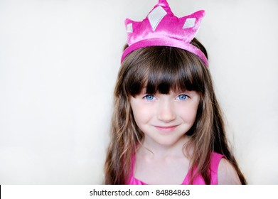 Portrait of beautiful little girl in pink tiara, isolated - Powered by Shutterstock