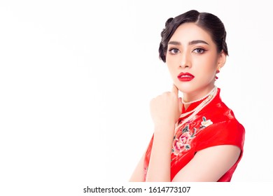 Portrait Beautiful Make Up Of Young Chinese Woman. Attractive Beautiful Asian Lady Apply Beautiful Makeup, Red Lips, Nice Hairdo. Pretty Girl Wear Chinese Dress. China Female Has Beauty Facial Skin