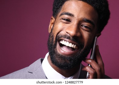 Portrait of a beautiful man with a phone - Shutterstock ID 1248827779