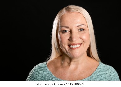 Portrait Of Beautiful Mature Woman On Dark Background