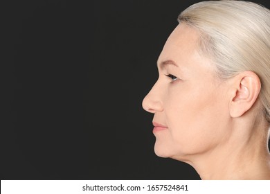 Portrait Of Beautiful Mature Woman On Black Background, Closeup. Space For Text