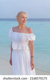 Portrait of a beautiful mature woman on the ocean.