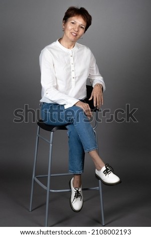 Similar – Woman in work wear in her workshop by table with handmade items