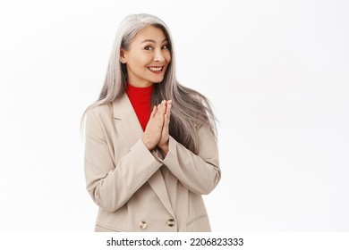 Portrait Of Beautiful Middle-aged Asian Woman With Grey Hair, Clap Hands, Smiling And Laughing Happy, Standing Over White Background.