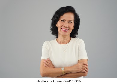 Portrait Of Beautiful Middle-aged Vietnamese Woman Smiling And Looking At The Camera