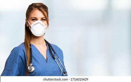 Portrait Of A Beautiful Nurse Wearing A Mask, Coronavirus Concept