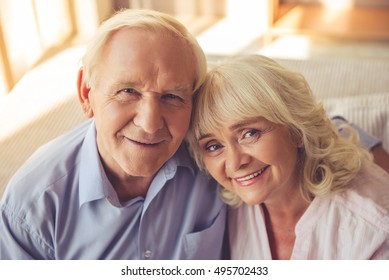 Portrait Of Beautiful Old Couple Looking At Camera And Smiling