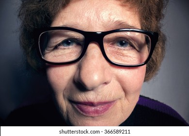 Portrait Of A Beautiful Older Woman With Glasses