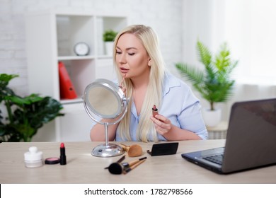 Portrait Of Beautiful Plus Size Blonde Woman Applying Make Up At Home Or In Office