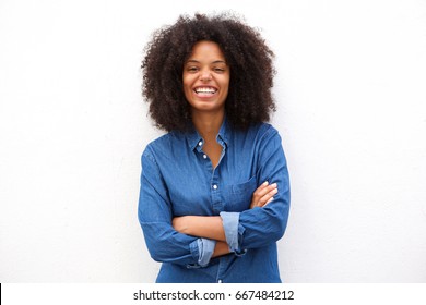 Portrait of beautiful positive african american woman standing with arms crossed