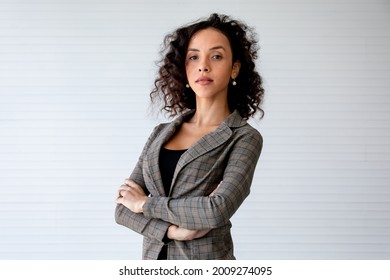 Portrait Beautiful Powerful And Successful African Businesswoman With Curly Hairstyle Wearing Formal Suit, Standing And Crossing Arms With Confident And Profession, Presenting Woman Leader, Diversity