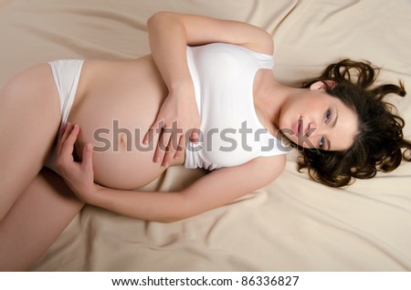 The portrait of the beautiful  pregnant woman