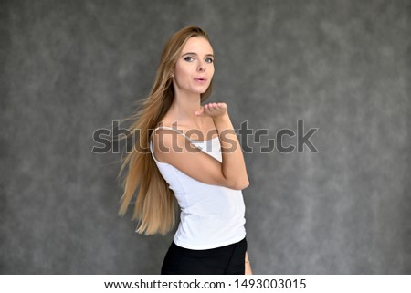 Similar – Happy young woman with moving hair in urban background