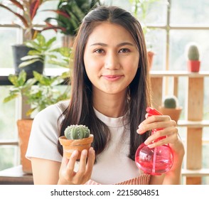 Portrait Beautiful Pretty Young Asian Girl Woman Long Black Hair One Person Smiling With Bright And Looking Hand Holding Pot Small Tree(cactus) In Houseplant Using Foggy Spray Water Work Shop Room