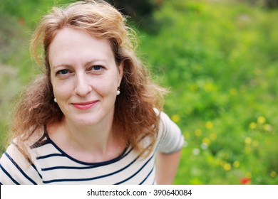 Portrait Of Beautiful Real 40 Years Old Woman In The Park