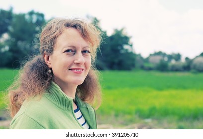Portrait Of Beautiful Real 40 Years Old Woman Walking In The Park