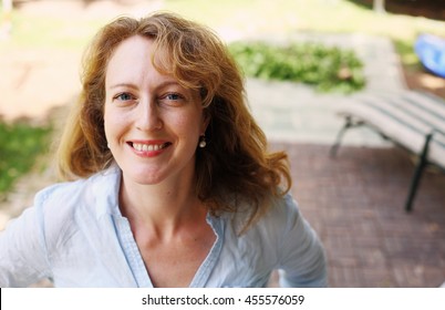 Portrait Of Beautiful Real 40 Years Old Woman In The Park