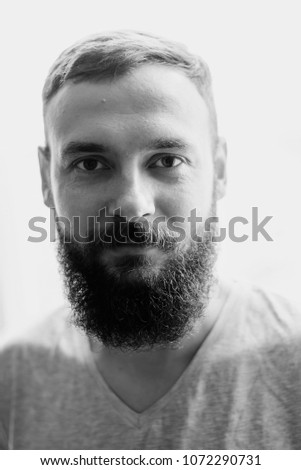 Similar – bearded guy in a cap