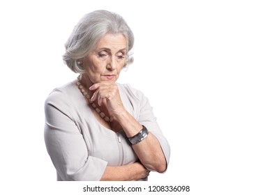 Portrait Of Beautiful Sad Senior Woman On White Background