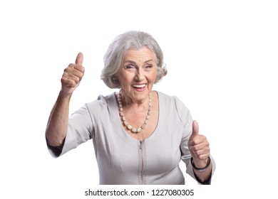 Portrait Of Beautiful Senior Woman Showing Thumbs Up