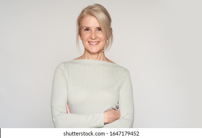 Portrait Of Beautiful Senior Woman Smiling. 50 Years Old Blonde Lady. Isolated