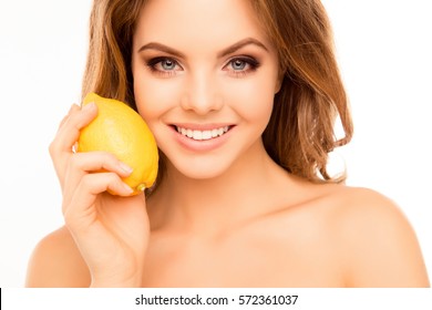 Portrait Of Beautiful Sensitive Woman Holding Lemon Near Face.