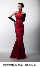Portrait Of Beautiful Sensual Woman In Fashion Red Dress. Christmas Sales And Shopping Concept