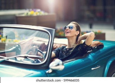 Portrait Of Beautiful Sexy Fashion Woman Model In Sunglasses Sitting In Luxury Retro Cabriolet Car