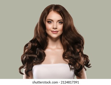 Portrait beautiful skin woman looking stright. Long curly hair . Color background - Powered by Shutterstock