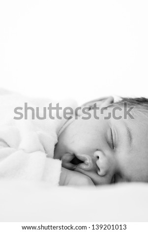 Similar – Newborn lying on bed embraced by her mother