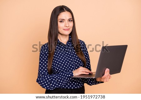 Portrait of beautiful smart skilled lady agent broker expert using laptop isolated over beige pastel color background
