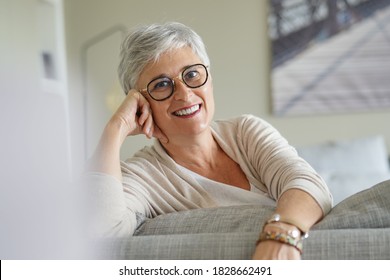 Portrait Of A Beautiful Smiling 55 Year Old Woman With White Hair