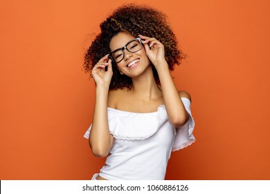 Portrait of beautiful smiling black woman in glasses 
