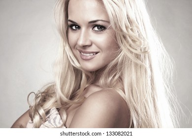 Portrait of beautiful smiling blond woman - Shutterstock ID 133082021
