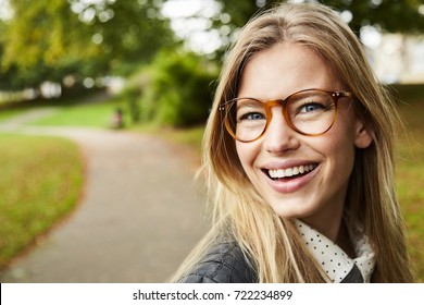 Portrait of beautiful smiling girl in glasses