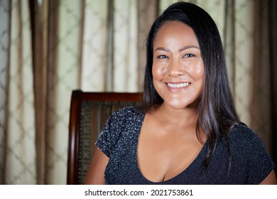 Portrait Of Beautiful Smiling Mature Woman With Long Shiny Hair Looking At Camera