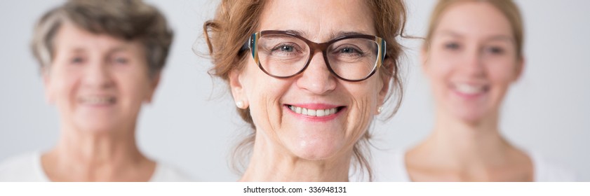 Portrait of beautiful smiling mother in glasses