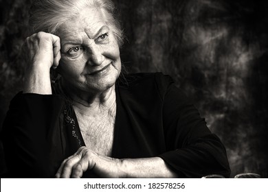 Portrait of a beautiful smiling senior woman. Black-and-white photo. - Powered by Shutterstock