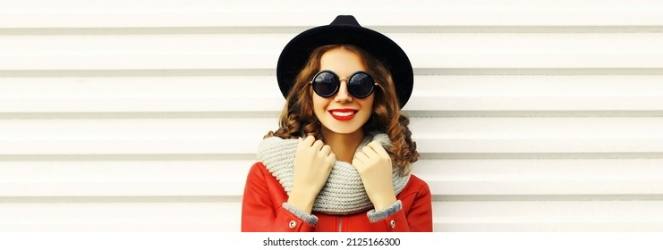 Portrait Of Beautiful Smiling Young Woman Model Wearing Scarf And Black Round Hat On White Background