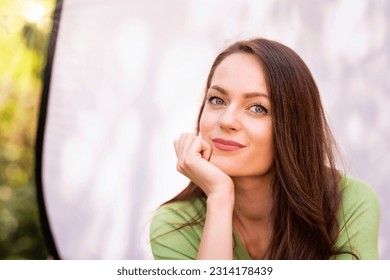 Portrait of beautiful smiling young woman. Attractive young female having green eyes and long brunette hair. Copy space.