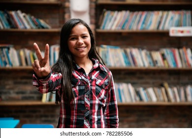 Portrait Of Beautiful Student Girl In The Library. Poor Infant Concept