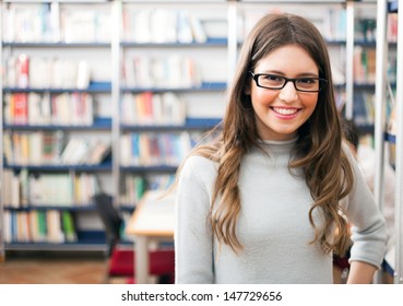 Portrait Of A Beautiful Student In A Library