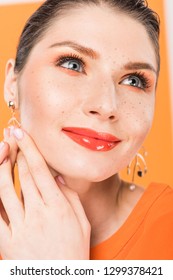 Portrait Of Beautiful Stylish Young Woman Posing With Tumeric On Background