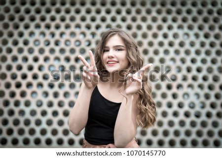 Similar – Beautiful young woman against a mirror wall