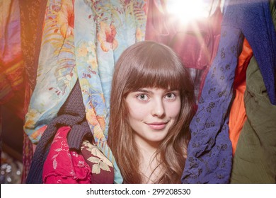 portrait of a beautiful teenage girl and her wardrobe, with bokeh