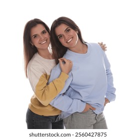 Portrait of beautiful twin sisters on white background - Powered by Shutterstock